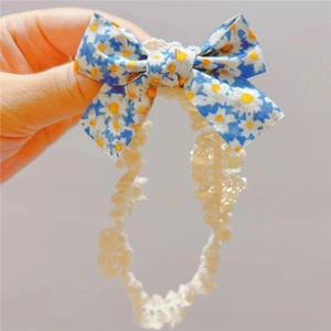 Bandeau bébé en dentelle blanche avec nœud à fleurs de marguerites pour nourrisson