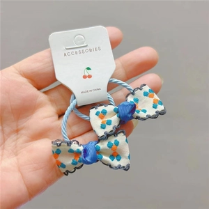 Elastici per capelli da bambina con mini fiocchi floreali blu e arancioni