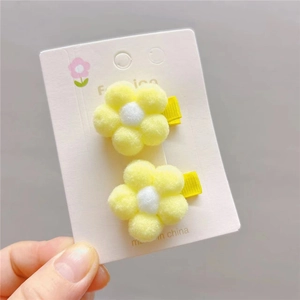 Set of 2 plush yellow and white flower hair clips for girls on display card