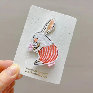 Cute embroidered white rabbit hair clip with pink flower and orange striped pants