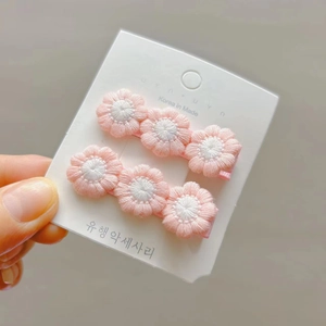 Set of two handmade crochet flower hair clips for girls in sweet pink and white colors