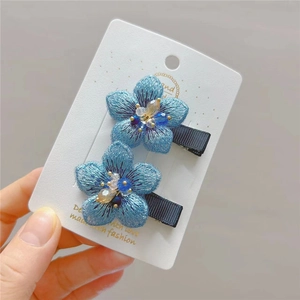 Exquisite blue embroidered flower hair clips with crystal beads on premium white display card