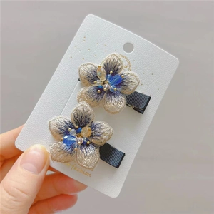 Exquisite 2-piece embroidered flower hair clips with crystal beadwork on white display card