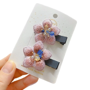 Pink embroidered flower hair clips with crystal bead centers in a two-piece gift set