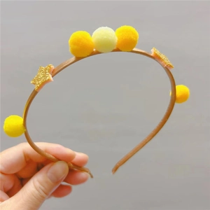 Serre-tête pour enfants avec pompons jaunes et étoiles dorées scintillantes pour fêtes