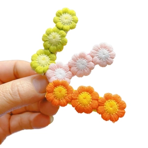 Three-piece set of sweet crochet flower hair clips for girls in various candy colors