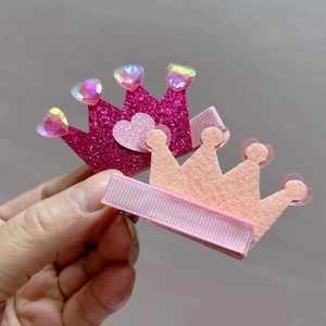 Sparkly heart crown hair clips for girls featuring pink glitter and felt textures