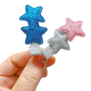 Glitter star hair clips for kids with blue and pink sequin finish on alligator clips