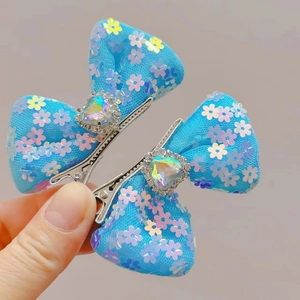 Sparkling blue mesh hair bow clip with heart-shaped gemstone and floral sequins decoration