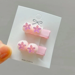 Pink sequin flower hair clips for girls with fuzzy pom poms and ribbon wrapped base