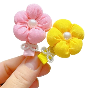 Pink and yellow fabric flower hair clips with large center pearls and bow details