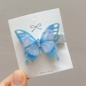Elegant blue butterfly hair clip for girls with gradient mesh and sparkling crystals