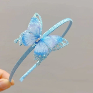 Detail of blue double-layer butterfly headband with sequins and rhinestone accents