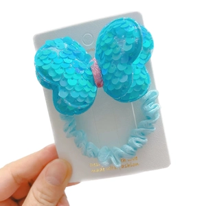 Sky blue sequin bow hair scrunchie with sparkling pink center for girls' ponytails