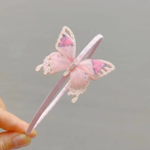 Close-up of pink butterfly headband for girls featuring translucent wings and silver glitter