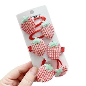 Sparkly sequin strawberry hair clips and elastics set for girls featuring red plaid fabric