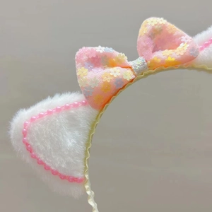 Cute pink plush cat ear headband for girls with sequin floral bow and pearl beads detail