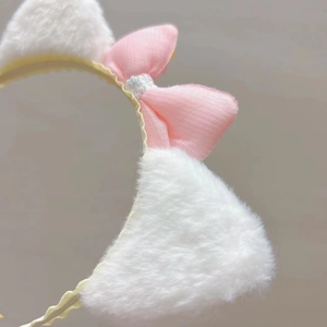 Pink plush cat ear headband for girls with sequined bow and soft faux fur material