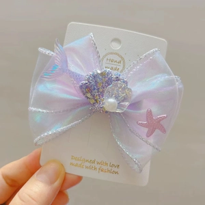 Barrette à cheveux nœud violet irisé avec queue de sirène coquillage et perle