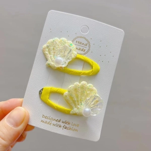 Paire de barrettes coquillage jaunes en tissu avec paillettes et perles pour filles