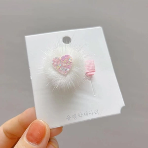 White faux fur mink hair clip with pink glitter heart on fabric wrapped barrette