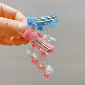 Detail of handmade bow hair clips with shell and pearl tassel pendants for Hanfu