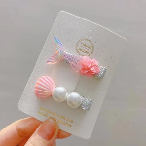 Girl's ocean theme hair clip set with pink mermaid tail shell and pearls on card