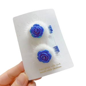 Lot de 2 barrettes à fleurs roses bleues lumineuses avec fausse fourrure blanche