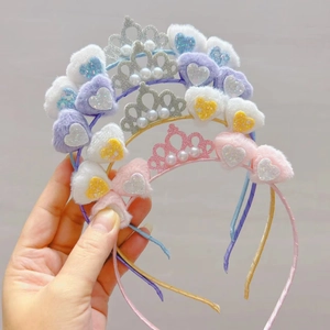 Detail of colorful plush heart headbands with glitter crowns and faux pearl accents