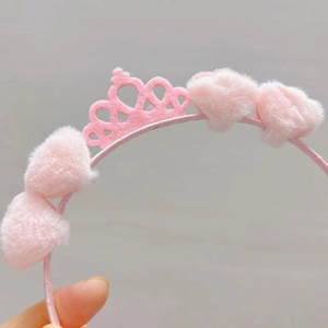 Detailed close-up of a pink plush headband with felt crown for children and girls