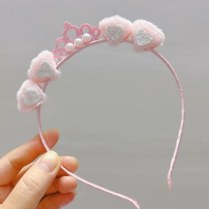 Pink plush heart headband with glitter crown and pearl accents for girls hair styling