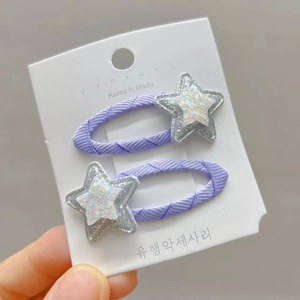 Cute purple woven star hair clips with silver glitter for kids on a card