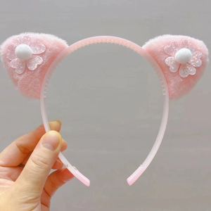 Serre-tête oreilles de chat en peluche rose avec fleurs à paillettes et design antidérapant
