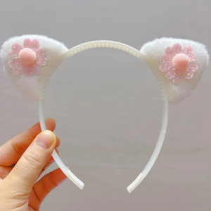 Serre-tête oreilles de chat en peluche blanche avec fleurs à paillettes roses pour Noël