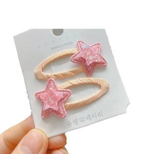 Colorful candy-colored star hair clips for girls with pink glitter finish on white card
