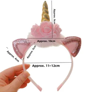 Detail showing dimensions of a white unicorn headband with gold horn and pink sequins