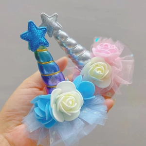 Detailed view of handmade unicorn hair clip with mesh lace and sequins for parties