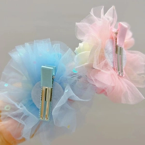 Detail of sequined mesh hair clip with durable ribbon-wrapped alligator clips