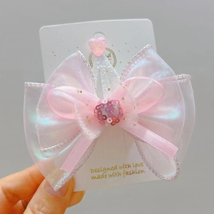 Pink bow hair clip for girls with 3D crown design and iridescent organza ribbon details