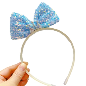 Meisjes haarband met blauwe pailletten strik en zilveren strass kroon voor feestjes