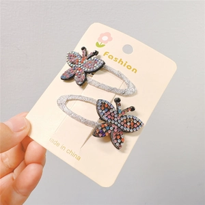 Close-up of sparkling colorful crystal butterfly hair clips in a two-piece set for kids