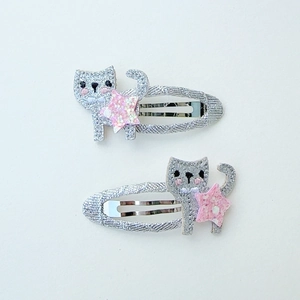 Sparkly silver glitter cat and pink star hair clips with bell detail for girls