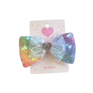 Barrette à cheveux nœud à paillettes arc-en-ciel avec perles et cœur argenté
