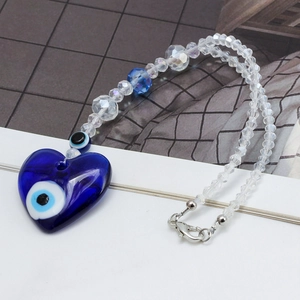 Detail of blue heart Evil Eye pendant with crystal beads and silver lobster clasp