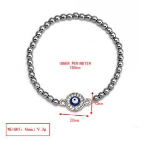 Detail view of Evil Eye charm beaded hematite bracelet with diamond-encrusted accents