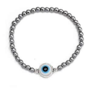 Detail shot of hematite beaded elastic bracelet with evil eye charm and metallic luster