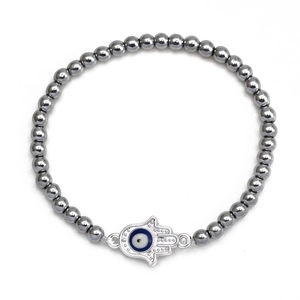 Close-up of beaded Hamsa Hand bracelet with blue Evil Eye charm and grey hematite beads