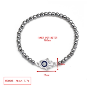 Detail view of hematite bead bracelet with Hamsa hand and evil eye charm dimensions
