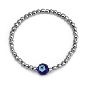 Detail view of Evil Eye beaded bracelet with silver metal beads and blue glass charm