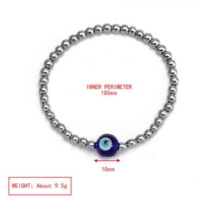 Detail of silver beaded evil eye bracelet with 180mm perimeter and 10mm blue center bead